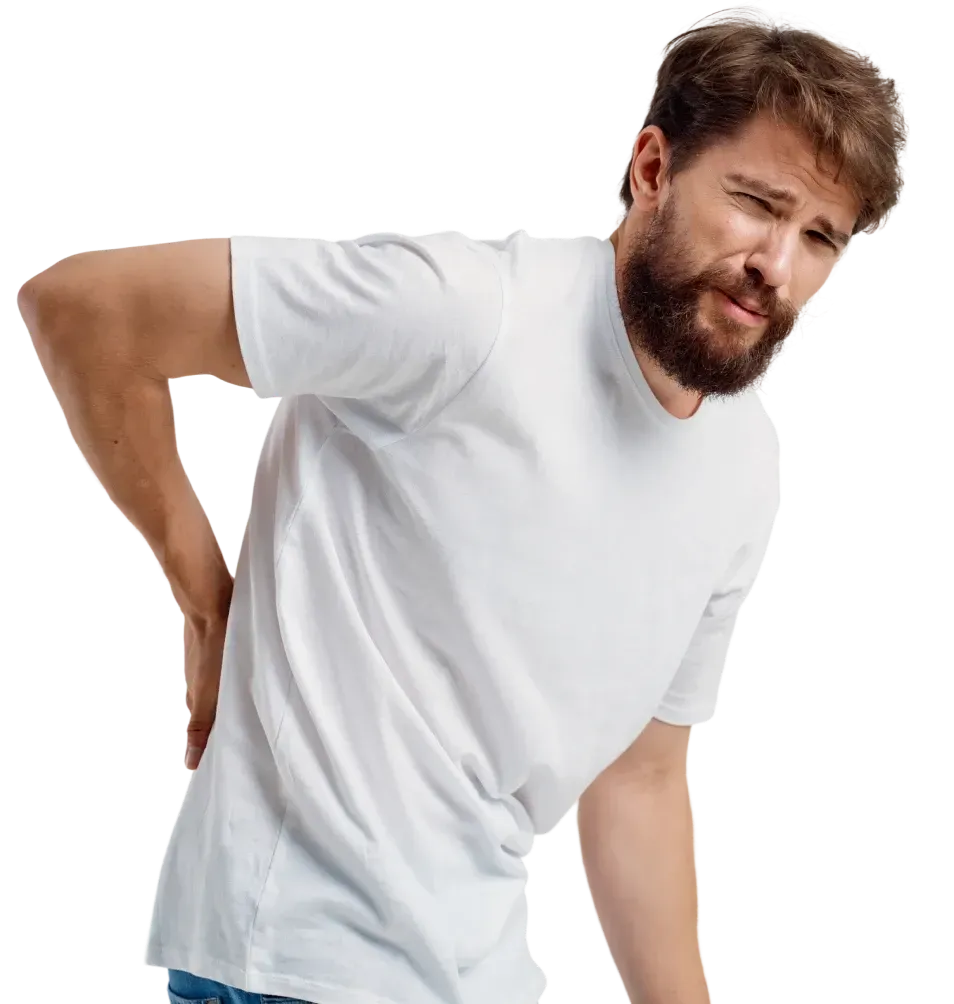 Man experiencing lower back pain before physiotherapy treatment at home in Dubai