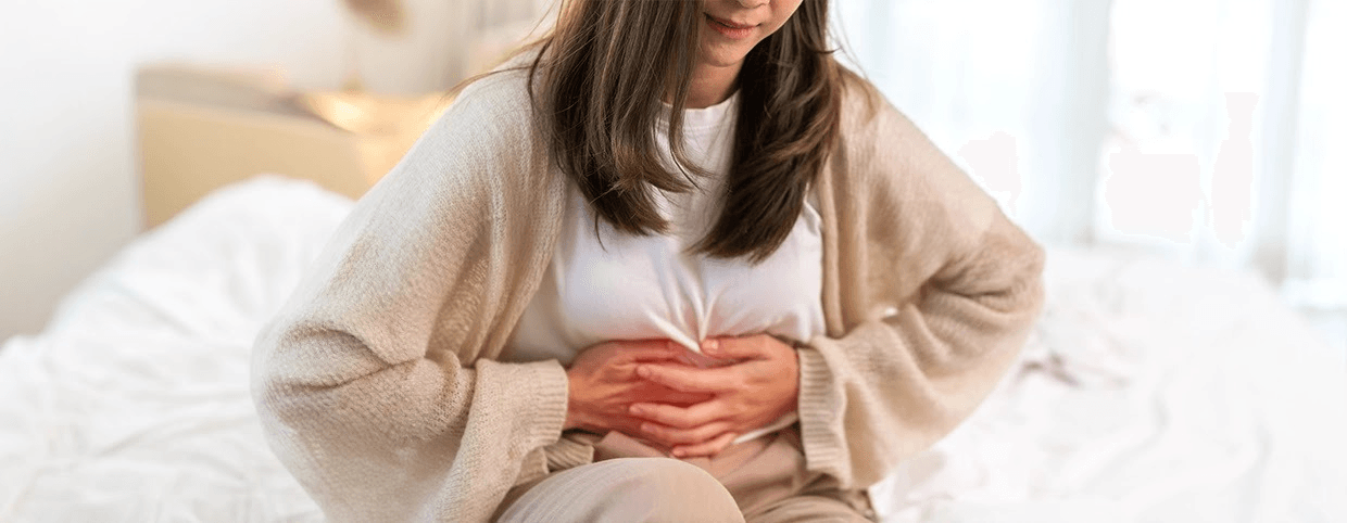 Woman experiencing abdominal pain from gastro symptoms