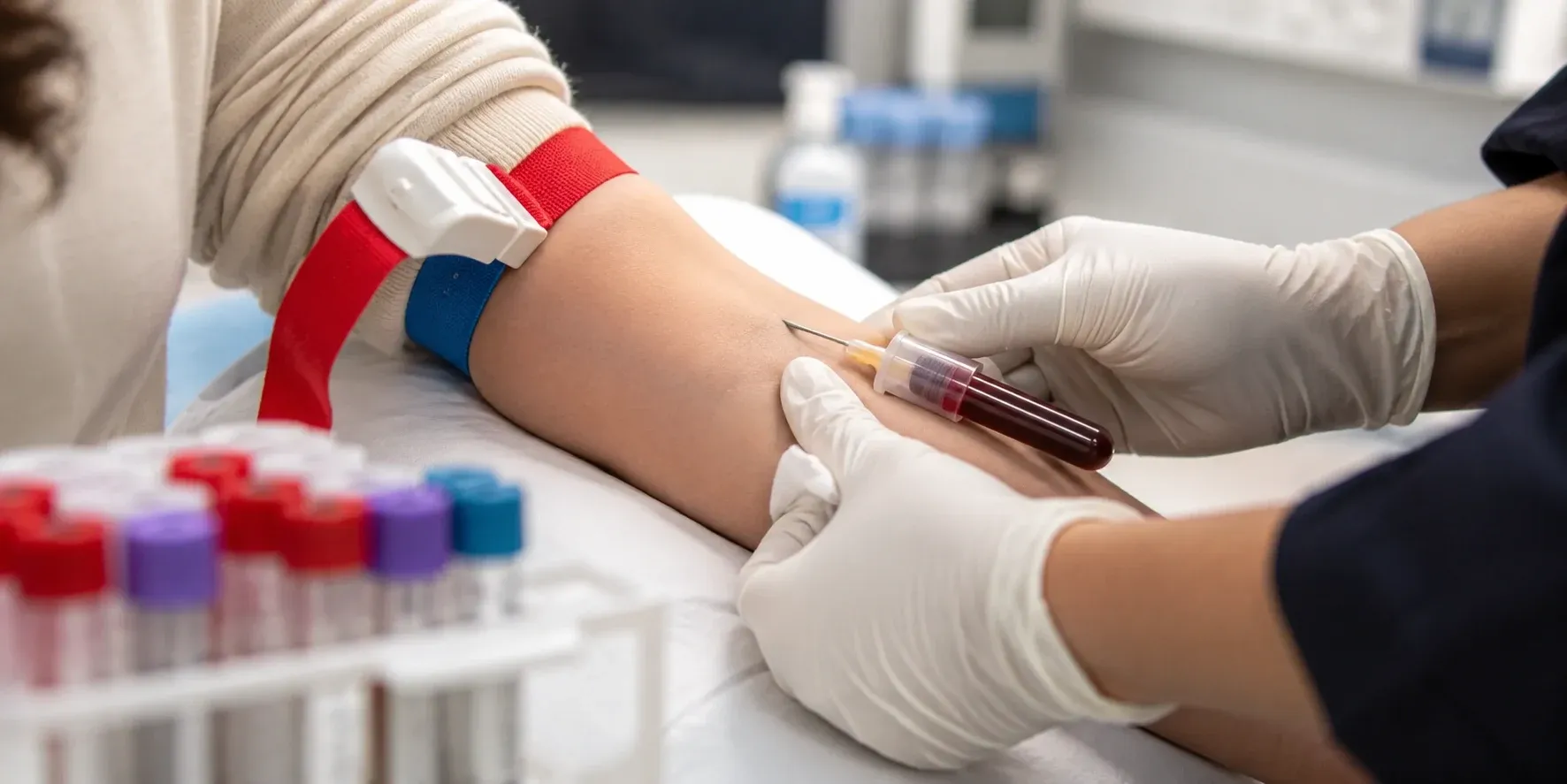 Nurse collecting HbA1c blood sample